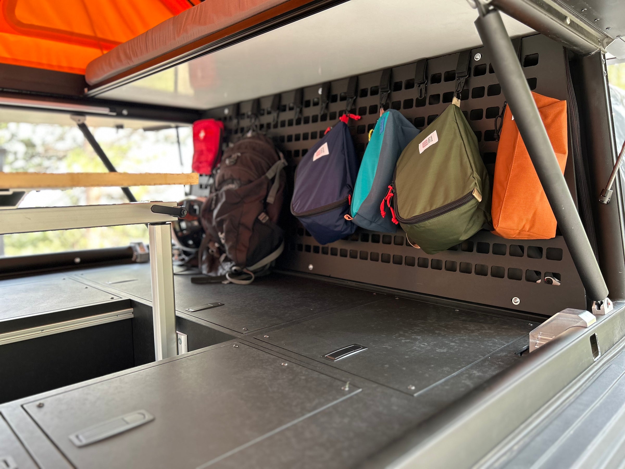 GFC Overland Camper - storage cabinets, interior seating, molle panel storage